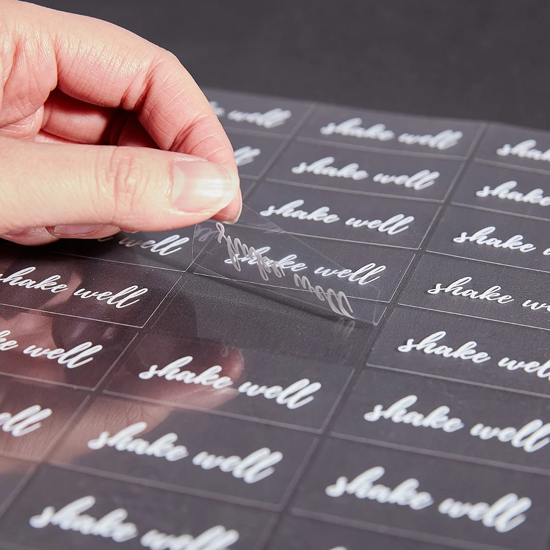 Labels, Shake Well, 2 x 1 Inch, Water Resistant, Clear with White Font,1 - 100 COUNT